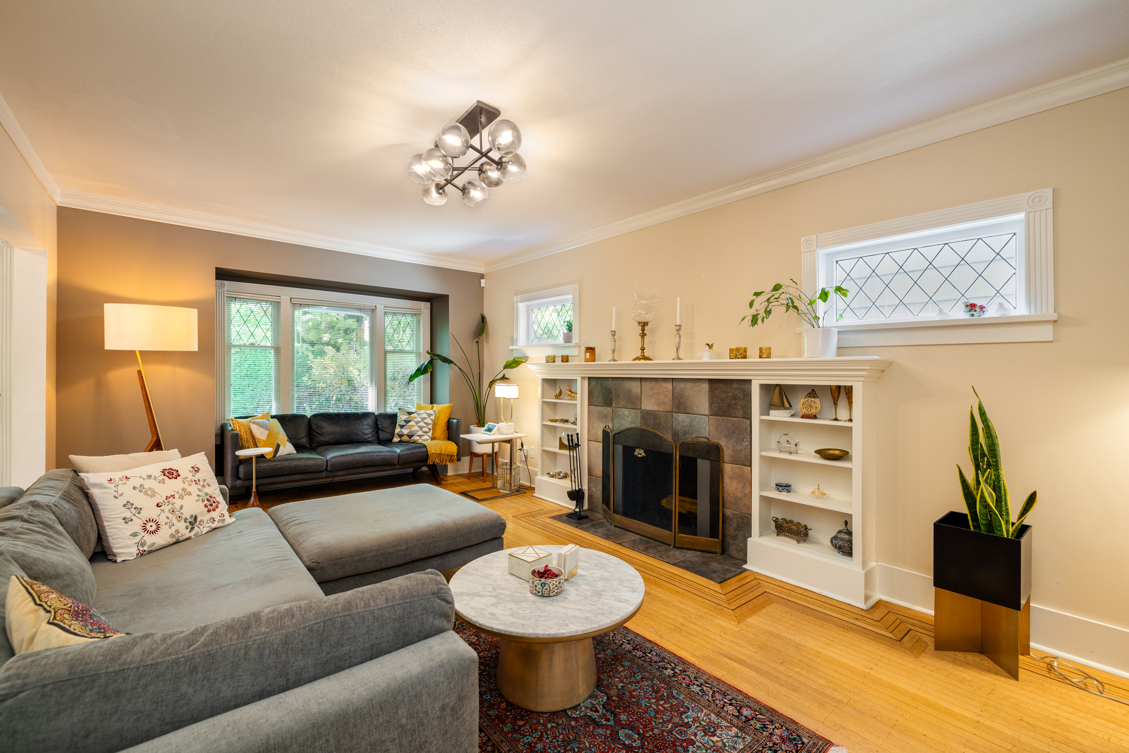 Living room from the opposite angle, showing fireplace mantel and built-ins